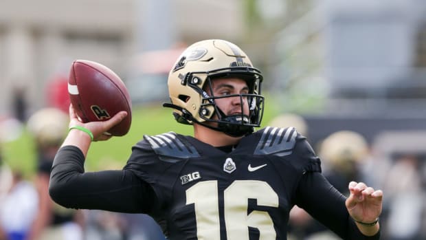 Purdue quarterback Aidan O'Connell throwing the football against Wisconsin