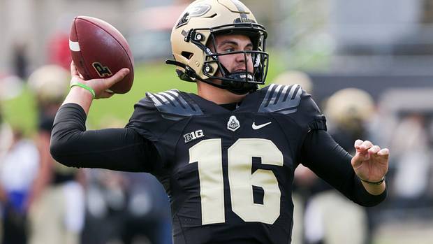 Purdue quarterback Aidan O'Connell throwing the football against Wisconsin