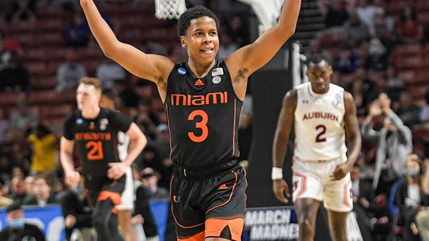 University of Miami guard Charlie Moore (3) celebrates after teammate forward Sam Waardenburg (21) dunked against Auburn University during the second half of the NCAA Div. 1 Men's Basketball Tournament preliminary round game at Bon Secours Wellness Arena in Greenville, S.C. Sunday, March 20, 2022. Ncaa Mens Basketball Second Round Miami Vs Auburn Syndication The Greenville News