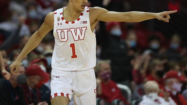 Wisconsin Badgers guard Johnny Davis (1) acknowledges an assist after completing a three-point basket during the game with the Iowa Hawkeyes during the first half at the Kohl Center.