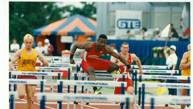 Hurdler Reggie Torian running while with the Wisconsin Badgers.