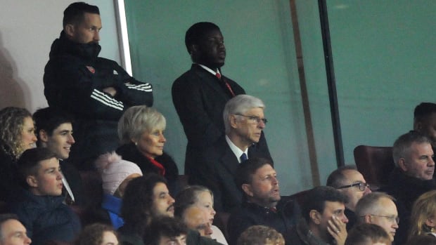 Arsene Wenger pictured (center) among the crowd at the Emirates Stadium during Arsenal's win over West Ham on Boxing Day in 2022