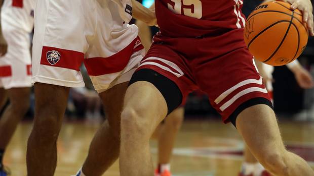 Wisconsin forward Markus Ilver backing his man down against Saint Francis of Brooklyn.
