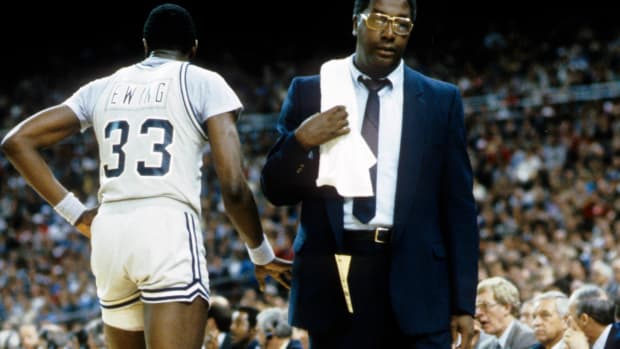 Georgetown head coach John Thompson and center Patrick Ewing during a timeout.