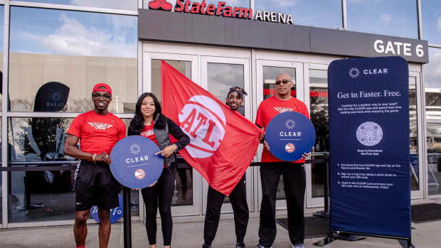 Volunteers posing outside of Hawks game.