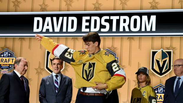 David Edstrom puts on a Vegas Golden Knights jersey
