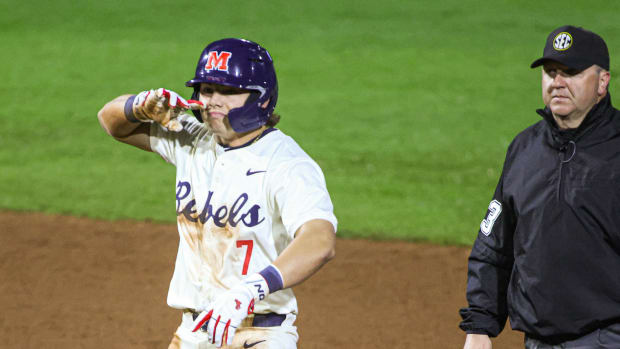 Ole Miss shortstop Luke Hill stands at second base after his two-run double in the sixth inning.