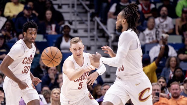 Mar 13, 2024; New Orleans, Louisiana, USA; Cleveland Cavaliers guard Sam Merrill (5) passes the ball to guard Darius Garland (10) against the New Orleans Pelicans during the first half at Smoothie King Center. Mandatory Credit: Stephen Lew-USA TODAY Sports
