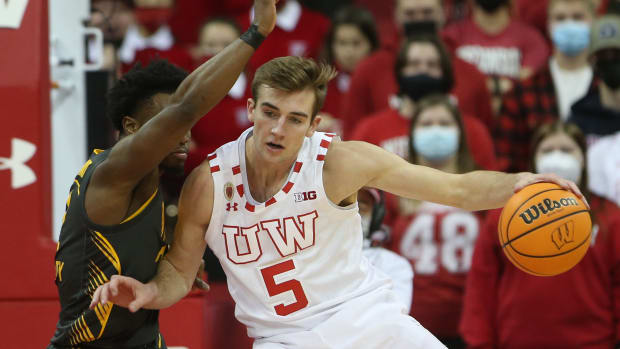 Wisconsin forward Tyler Wahl backing down an Iowa defender at the Kohl Center.