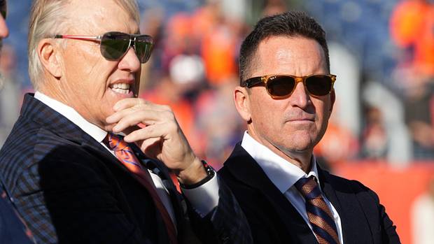 Denver Broncos president John Elway (left) and general manager George Paton (right) before the game against the Detroit Lions at Empower Field at Mile High.