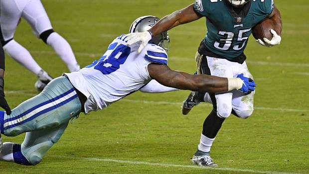 Boston Scott runs for some of his 70 yards against the Cowboys on Nov. 1