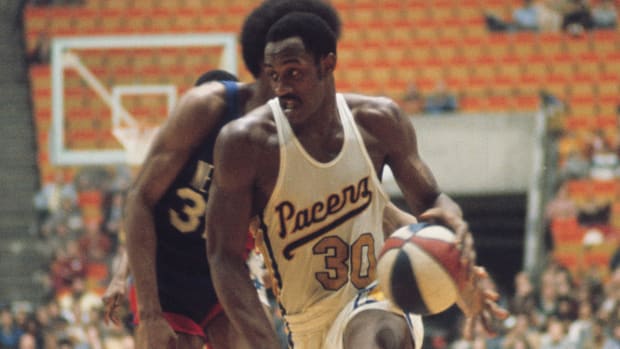 Pacers forward George McGinnis (30) against the New York Nets during an ABA game.