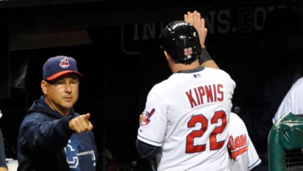 Sep 25, 2013; Cleveland, OH, USA; Cleveland Indians second baseman Jason Kipnis (22) is congratulated by manager Terry Francona after scoring in the seventh inning against the Chicago White Sox at Progressive Field. Mandatory Credit: David Richard-USA TODAY Sports
