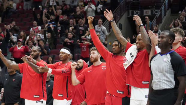 The Chicago Bulls celebrate a basket against the Denver Nuggets during the second half at United Center