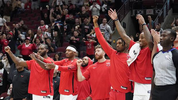 The Chicago Bulls celebrate a basket against the Denver Nuggets during the second half at United Center