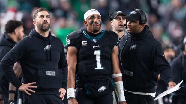 Philadelphia Eagles head coach Nick Sirianni (L) and quarterback Jalen Hurts (1) and offensive coordinator Brian Johnson (R) talk during the second quarter against the New York Giants at Lincoln Financial Field. Mandatory Credit: Bill Streicher-USA TODAY Sports