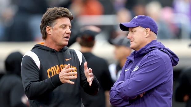 Oklahoma State head coach Mike Gundy talks with Kansas State head football coach Chris Klieman before the college football game between the Oklahoma State University Cowboys and the Kansas State Wildcats at Boone Pickens Stadium in Stillwater. Okla., Friday, Oct. 6, 2023.