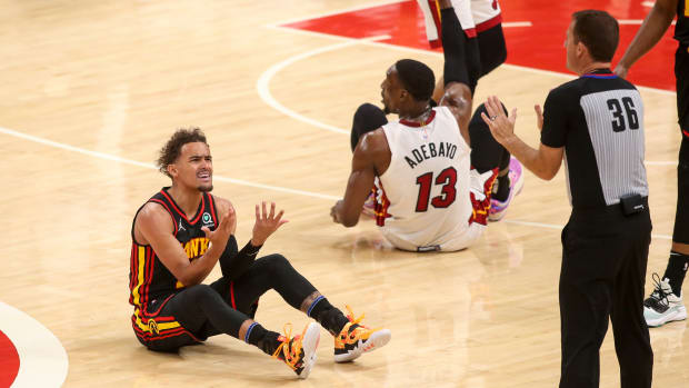 Atlanta Hawks guard Trae Young reacts to a foul during a game against Miami Heat.
