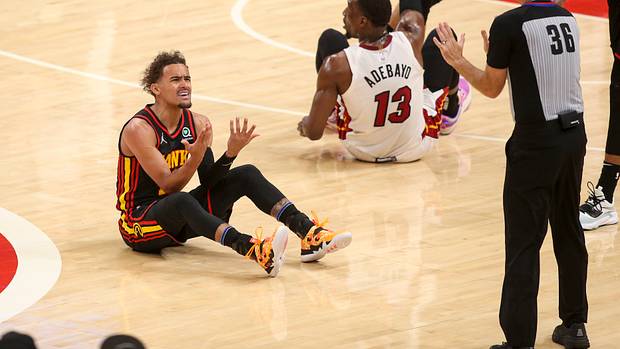Atlanta Hawks guard Trae Young reacts to a foul during a game against Miami Heat.