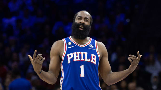 76ers guard James Harden questions a foul call.