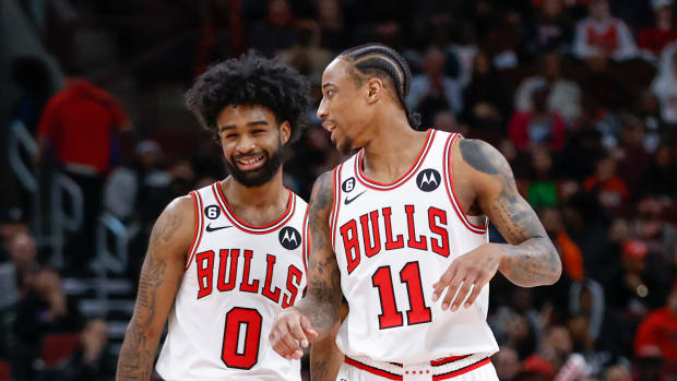 Feb 6, 2023; Chicago, Illinois, USA; Chicago Bulls guard Coby White (0) chats with forward DeMar DeRozan (11) during the first half of an NBA game against the San Antonio Spurs at United Center.