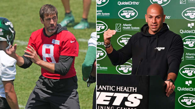 Separate photos of Aaron Rodgers in a red practice jersey and Robert Saleh at a podium with a Jets background