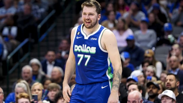 Dallas Mavericks guard Luka Doncic (77) laughs during the game against the Sacramento Kings at American Airlines Center.
