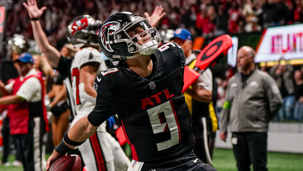 Dec 10, 2023; Atlanta, Georgia, USA; Atlanta Falcons quarterback Desmond Ridder (9) reacts after scoring a touchdown against the Tampa Bay Buccaneers during the second half at Mercedes-Benz Stadium. Mandatory Credit: Dale Zanine-USA TODAY Sports