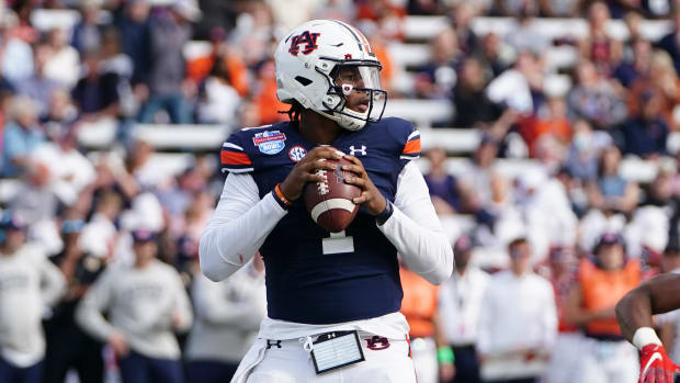 Auburn Tigers quarterback TJ Finley (1) looks to pass against the Houston Cougars during the second half of the 2021 Birmingham Bowl at Protective Stadium.