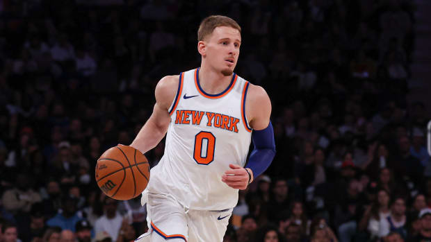 New York Knicks guard Donte DiVincenzo dribbles the basketball.