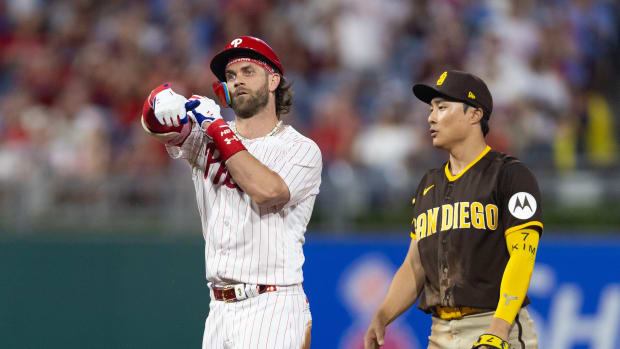 Jul 15, 2023; Philadelphia, Pennsylvania, USA; Philadelphia Phillies designated hitter Bryce Harper (3) reacts next to San Diego Padres second baseman Ha-Seong Kim (7) after hitting a double during the fifth inning at Citizens Bank Park. Mandatory Credit: Bill Streicher-USA TODAY Sports