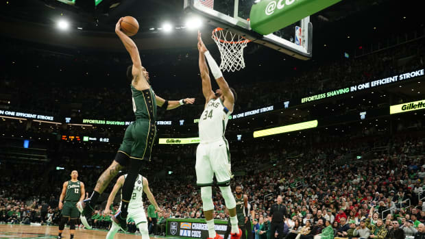 Milwaukee Bucks forward Giannis Antetokounmpo defends Boston Celtics forward Jayson Tatum