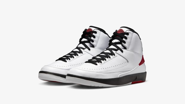 View pf white, red, and black Jordan shoes.
