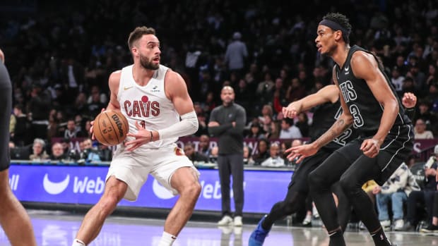 Feb 8, 2024; Brooklyn, New York, USA; Cleveland Cavaliers guard Max Strus (1) looks to drive past Brooklyn Nets center Nic Claxton (33) in the second quarter at Barclays Center. Mandatory Credit: Wendell Cruz-USA TODAY Sports