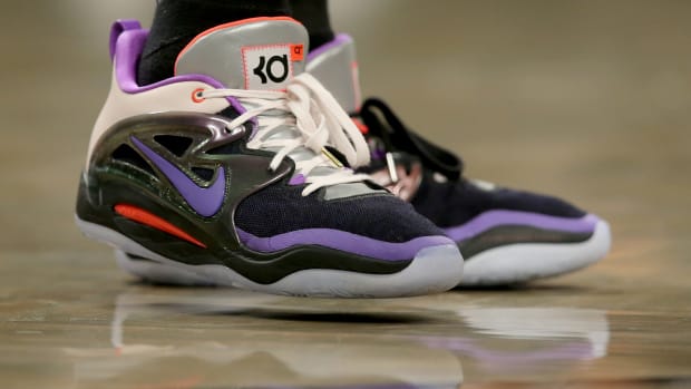 View of black and purple Nike KD shoes.