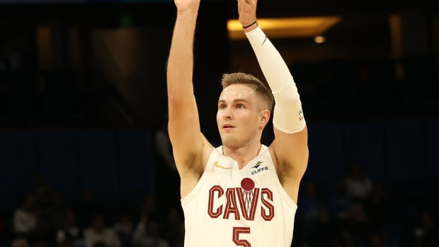 Jan 22, 2024; Orlando, Florida, USA; Cleveland Cavaliers guard Sam Merrill (5) makes a three-point shot against the Orlando Magic during the first quarter at Kia Center. Mandatory Credit: Kim Klement Neitzel-USA TODAY Sports