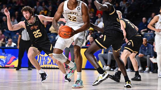 Drexel Dragons forward Amari Williams (22) drives against Charleston Cougars forward Babacar Faye (35) in the second half at Daskalakis Athletic Center.