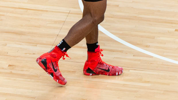 View of red and black Nike Kobe shoes.