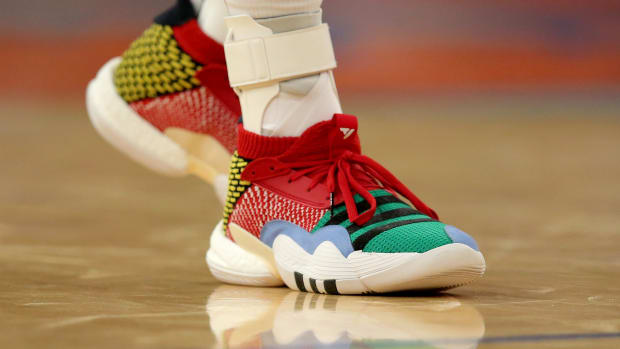 View of Trae Young's multi-color Adidas shoes.
