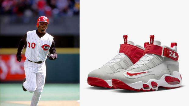 Cincinnati Reds outfielder Ken Griffey Jr. next to his red and grey Nike sneakers.