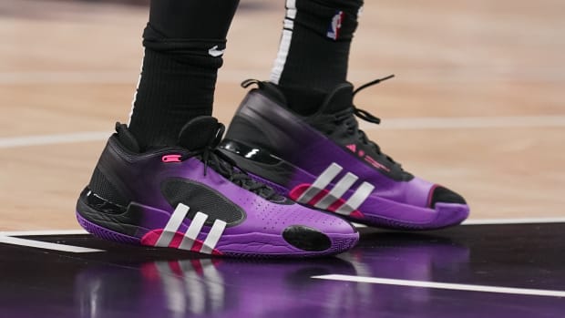 Cleveland Cavaliers guard Donovan Mitchell's purple and black adidas sneakers.