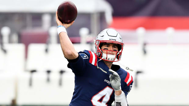New England Patriots quarterback Jarrett Stidham (4) makes a pass during warmups before a game against the New York Jets at Gillette Stadium.