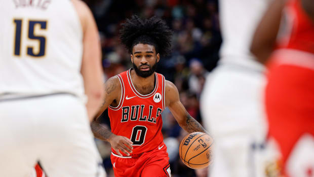Chicago Bulls guard Coby White (0) dribbles the ball up court in the second quarter against the Denver Nuggets at Ball Arena