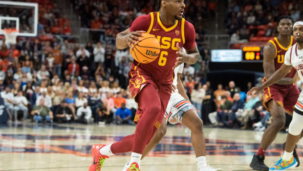 USC Trojans guard Bronny James dribbles the basketball to the rim.