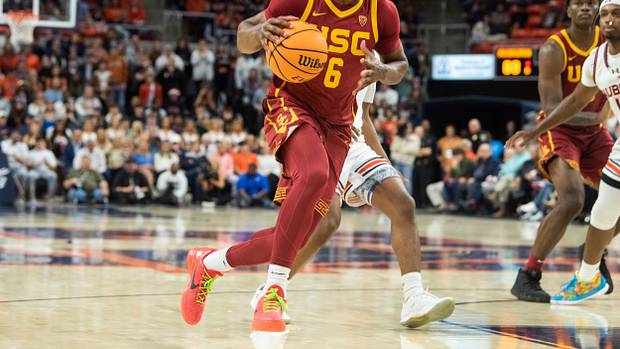 USC Trojans guard Bronny James dribbles the basketball to the rim.