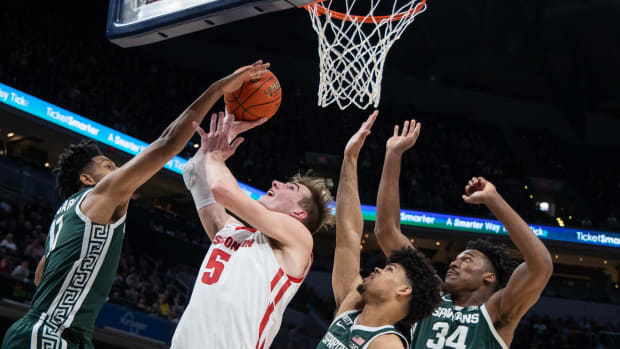 Tyler Wahl is blocked at the rim, as the Badgers fall to Michigan State in the B1G Tournament.