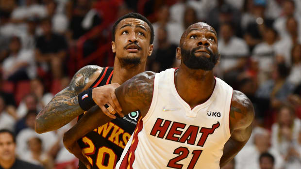Apr 17, 2022; Miami, Florida, USA; Miami Heat center Dewayne Dedmon (21) and Atlanta Hawks forward John Collins (20) battle for rebounding position during the second half of game one of the first round for the 2022 NBA playoffs at FTX Arena.