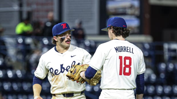 Ole Miss third baseman Andrew Fischer and relief pitcher Mitch Murrell on Friday night at Swayze Field.
