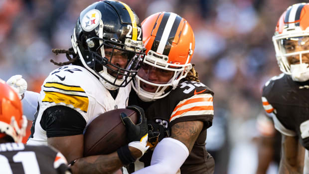 Nov 19, 2023; Cleveland, Ohio, USA; Cleveland Browns safety Ronnie Hickman (33) tackles Pittsburgh Steelers running back Najee Harris (22) during the fourth quarter at Cleveland Browns Stadium. Mandatory Credit: Scott Galvin-USA TODAY Sports  