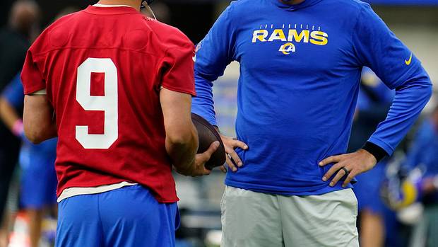 Los Angeles Rams quarterback Matthew Stafford (9) talks to offensive coordinator Kevin O'Connell during an offseason workout at SoFi Stadium.